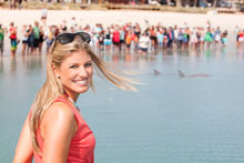 lady looking at dolphins
